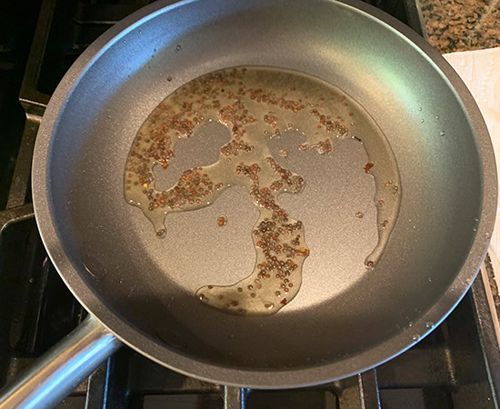 black mustard seeds in a pan