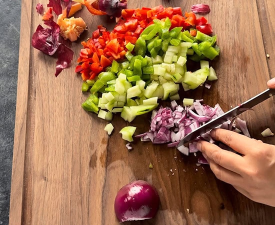 vegetables being chopped using a knife