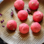 rose malai ladoo in a bronze thali