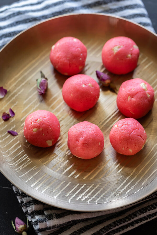 rose malai ladoo in a bronze thali