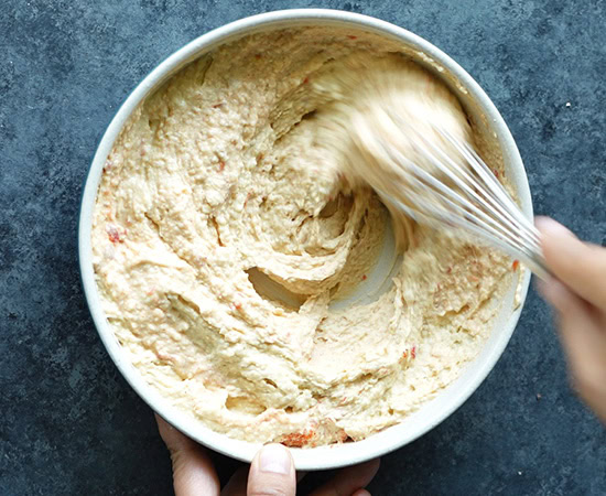 whisking hummus