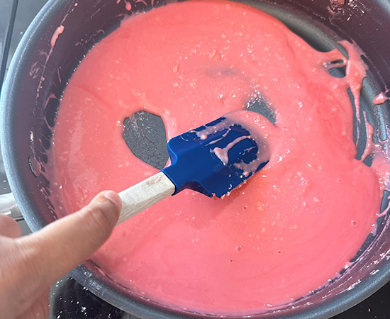 pink color mixture in a pan