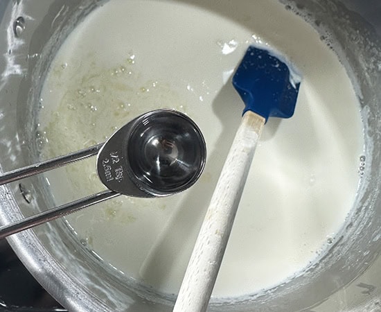 vinegar being added to milk