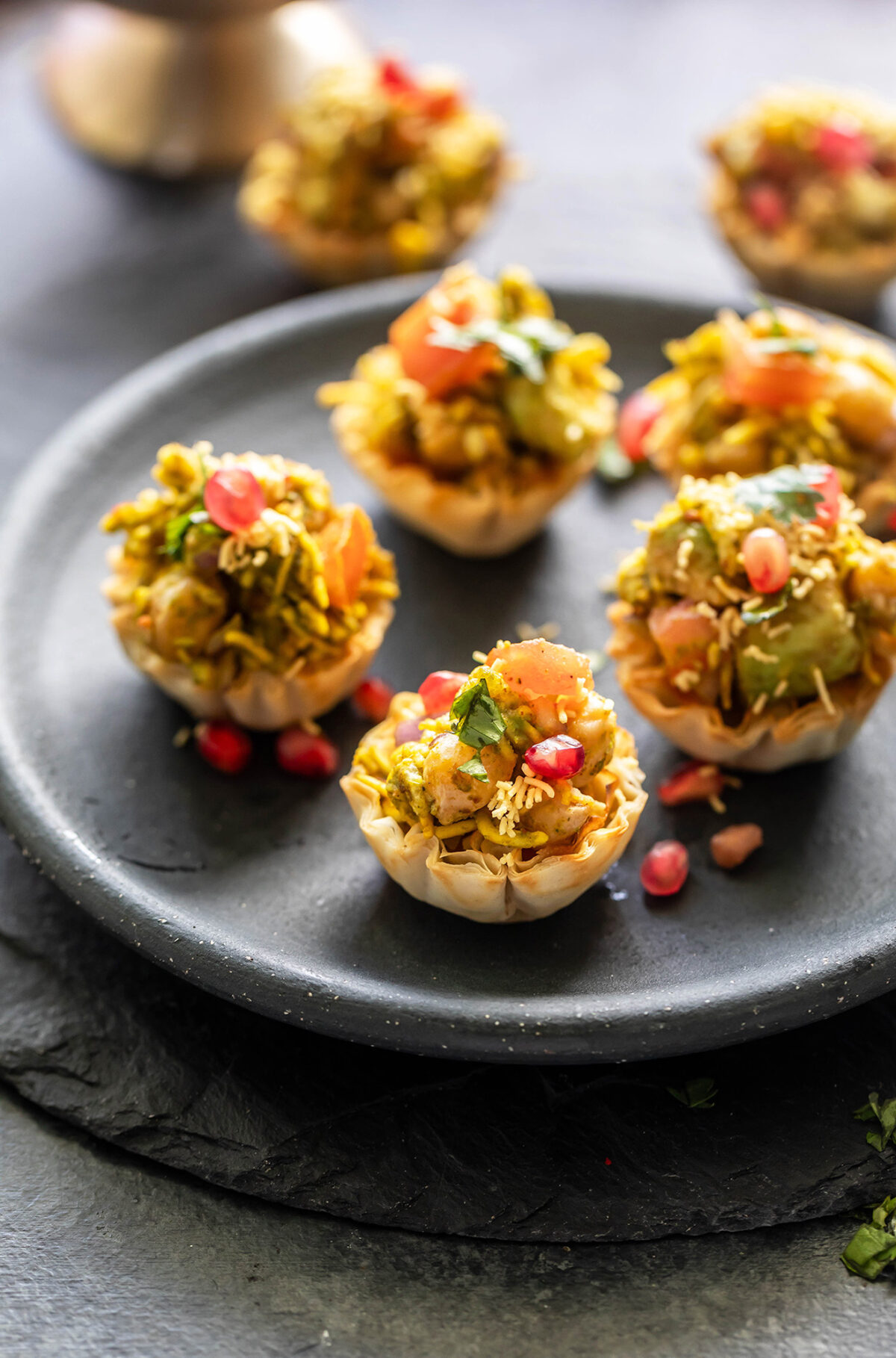 phyllo shells topped with chickpea, avocado, pomegranate