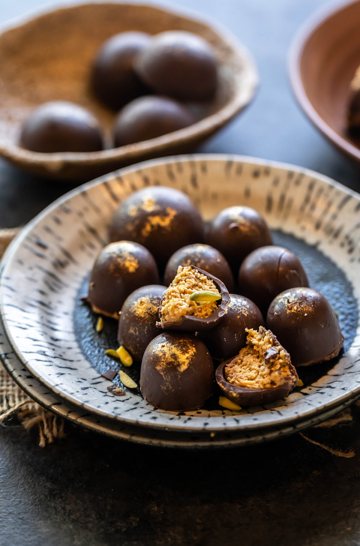 chocolate truffle broken in half to show the inside