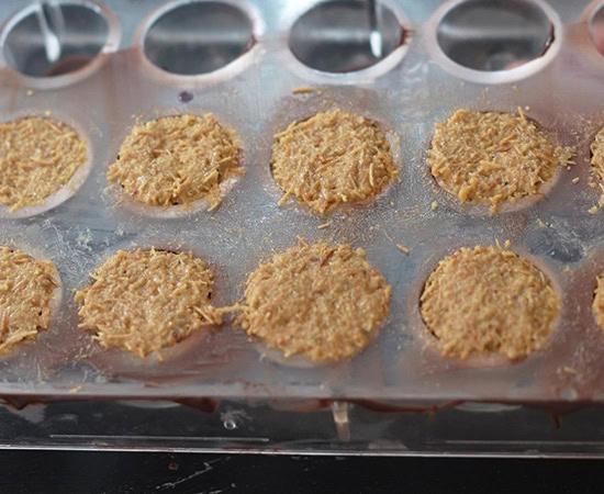 chocolate molds filled with kataifi pistachio mixture