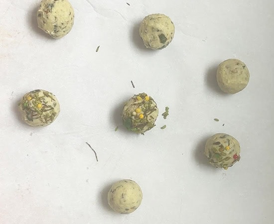 rolled paan cookies placed on parchment paper