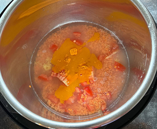 masoor dal with tomatoes and water added to an instant pot